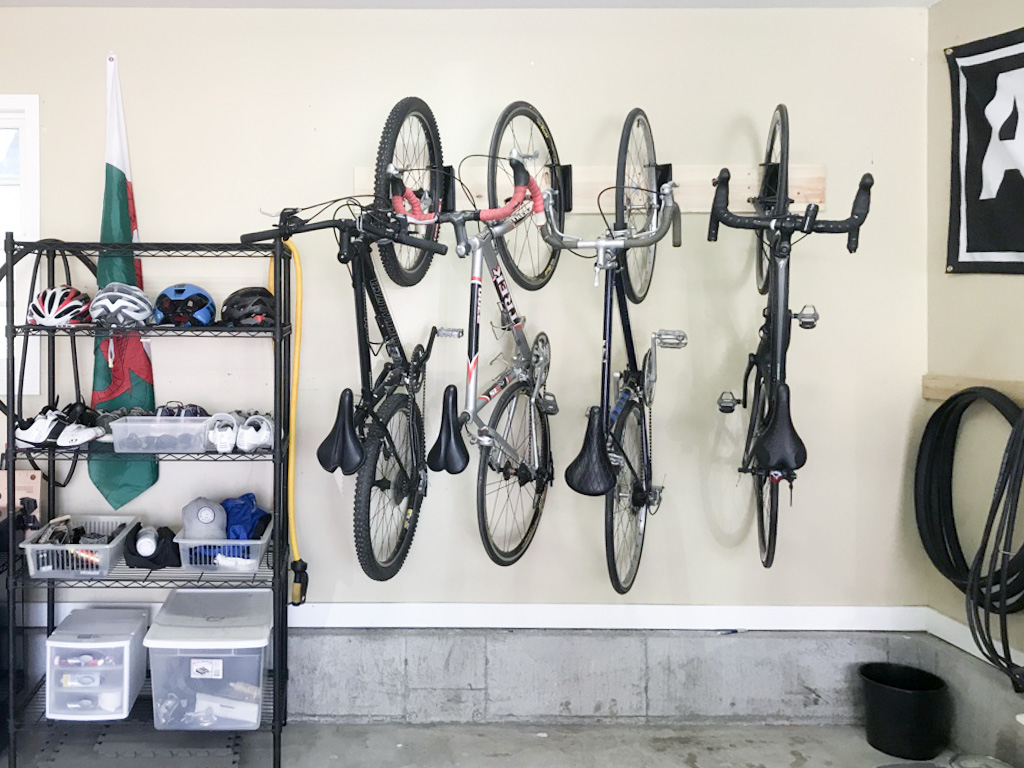 Pictures of bicycles hanging in a garage